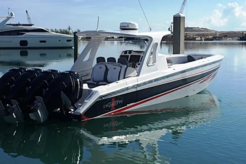 The Image of 2017 Cigarette 39' GTS boat with multiple engines docked in a marina. - 0