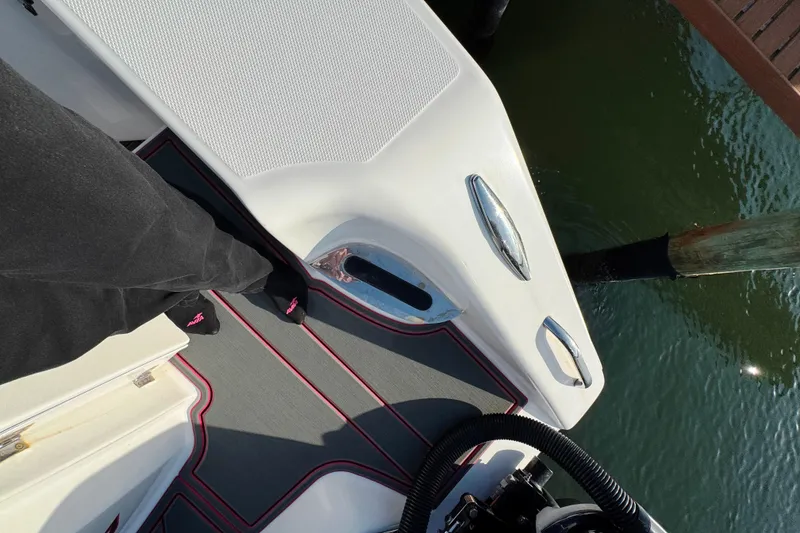 Slide: The Image of 2017 Cigarette 39' GTS boat deck with person standing, docked by water. - 10