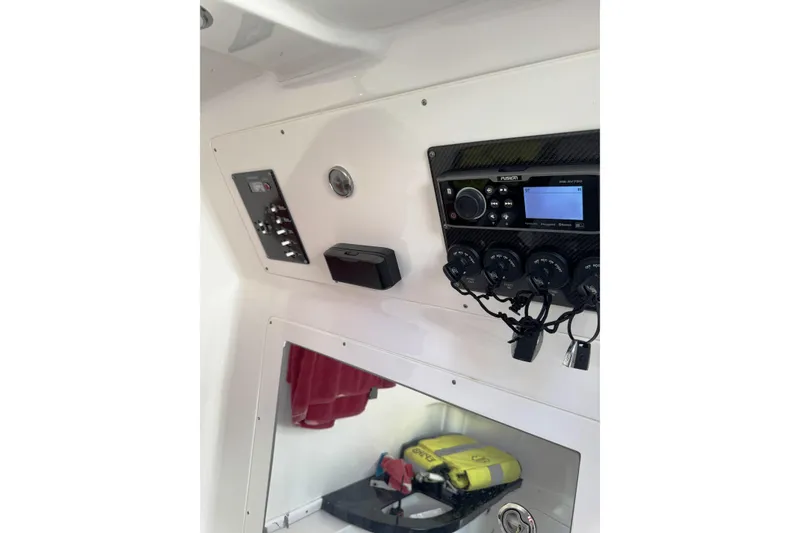 Slide: The Image of 2017 Cigarette 39' GTS boat dashboard with control panel and stereo system. - 12