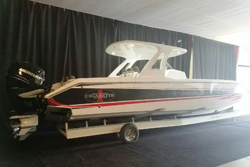 Slide: The Image of 2017 Cigarette 39' GTS boat with Mercury engines on display indoors. - 13