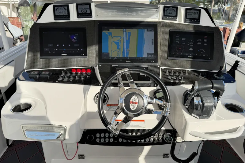 Slide: The Image of 2017 Cigarette 39' GTS boat dashboard with advanced navigation and control systems. - 4