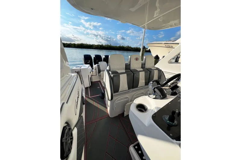 Slide: The Image of 2017 Cigarette 39' GTS boat interior with luxury seating and scenic water view. - 7