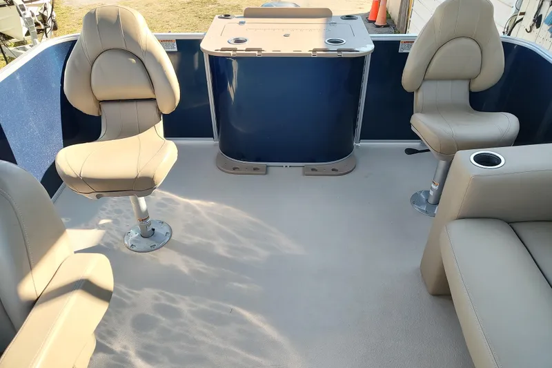 Slide: The Image of 2023 Sylvan Mirage 8520 Party Fish interior with beige seating and table. - 10