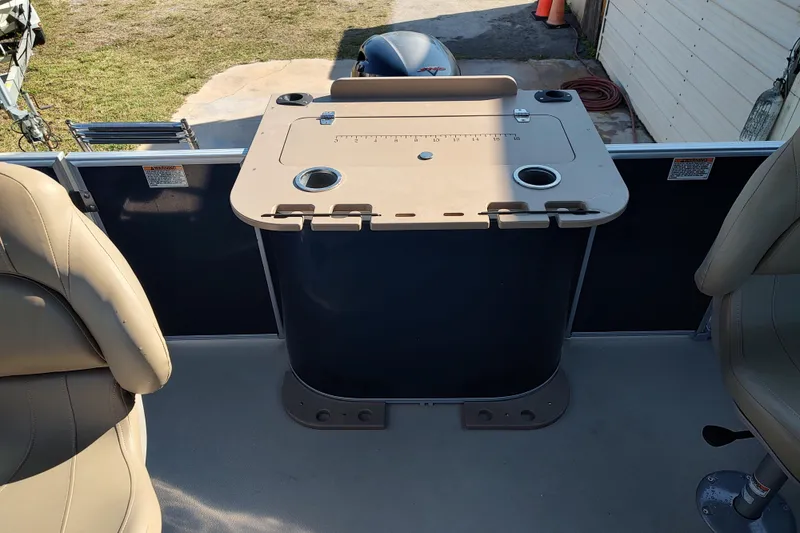 Slide: The Image of 2023 Sylvan Mirage 8520 Party Fish boat interior with seating and fishing station. - 11