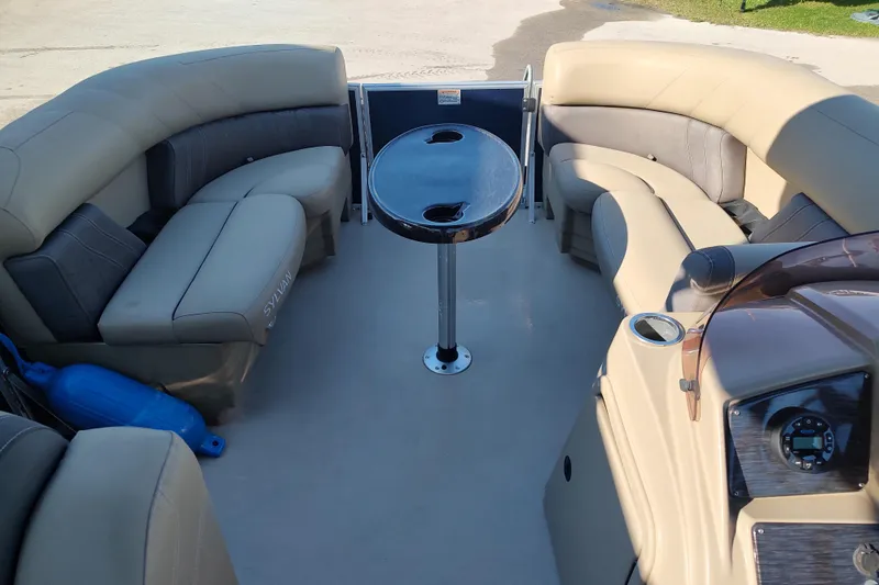 Slide: The Image of 2023 Sylvan Mirage 8520 Party Fish boat interior with seating and table. - 15