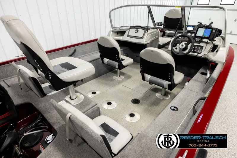 Slide: The Image of 2017 Tracker Pro Guide V-175 Combo boat interior with seating and control panel. - 10