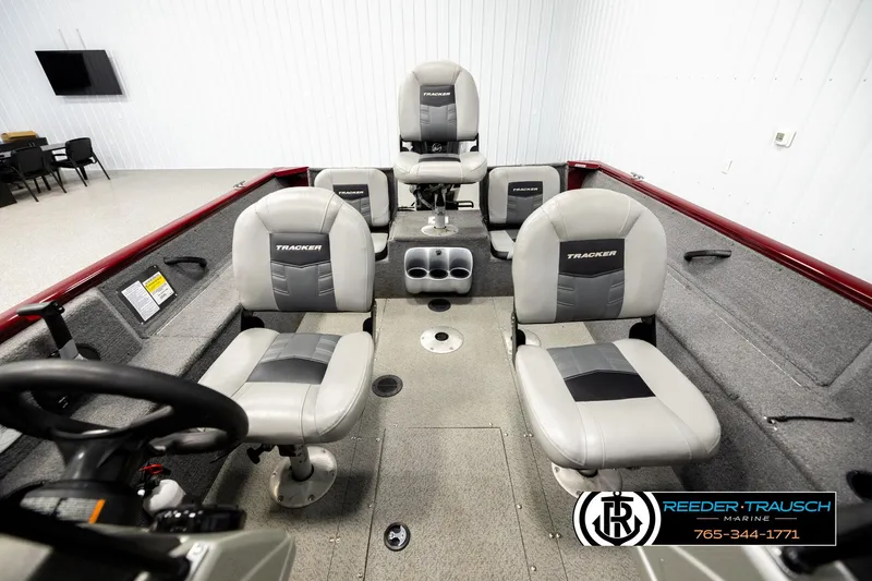 Slide: The Image of 2017 Tracker Pro Guide V-175 Combo boat interior with seating and steering wheel. - 15