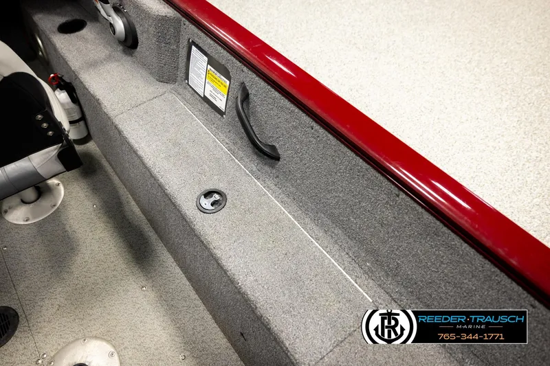 Slide: The Image of 2017 Tracker Pro Guide V-175 Combo boat interior with gray carpet and red trim. - 22