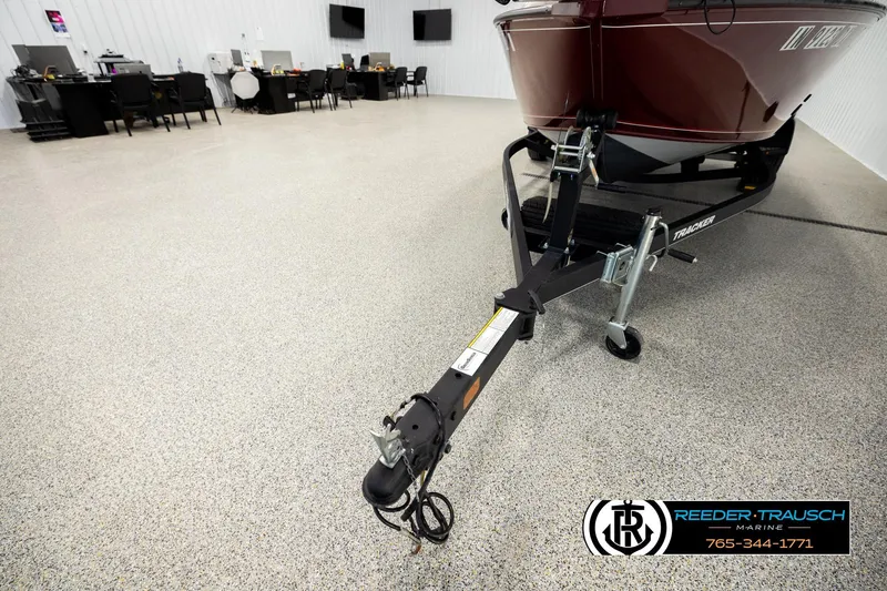 Slide: The Image of 2017 Tracker Pro Guide V-175 Combo boat on trailer in showroom. - 26