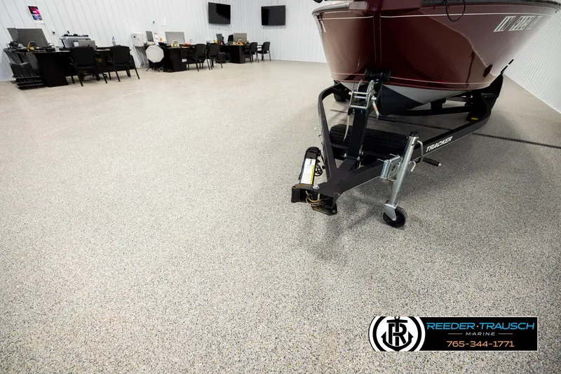 Slide: The Image of 2017 Tracker Pro Guide V-175 Combo boat in showroom with Reeder-Trausch Marine logo. - 27