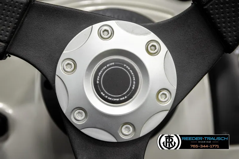 Slide: The Image of Steering wheel of 2017 Tracker Pro Guide V-175 Combo boat, featuring Reeder-Trausch Marine logo. - 30