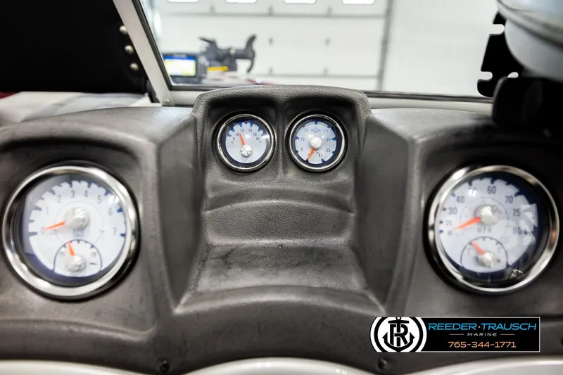 Slide: The Image of Dashboard of 2017 Tracker Pro Guide V-175 Combo boat with gauges and controls. - 32
