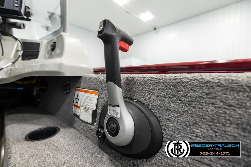 Slide: The Image of 2017 Tracker Pro Guide V-175 Combo boat throttle control in a carpeted interior. - 35
