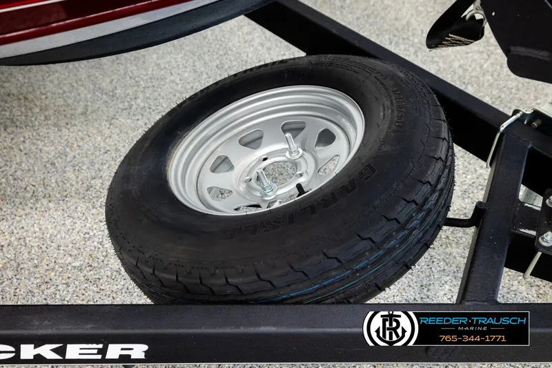 Slide: The Image of 2017 Tracker Pro Guide V-175 Combo trailer tire with steel rim, Reeder-Trausch Marine branding. - 54
