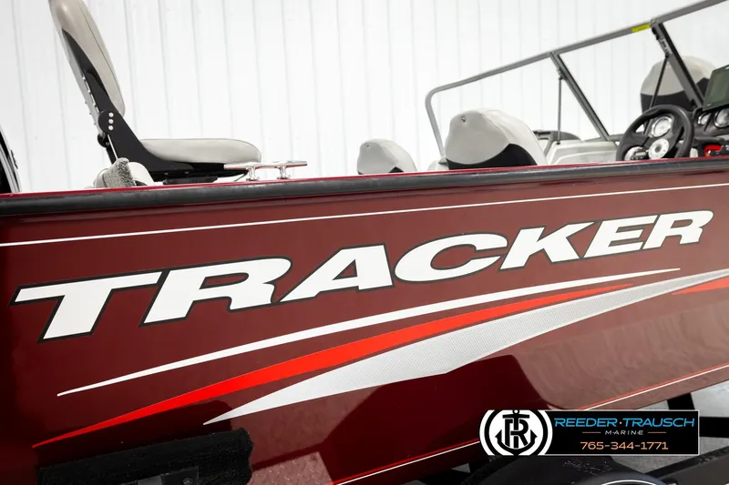 Slide: The Image of 2017 Tracker Pro Guide V-175 Combo boat, red exterior, side view with logo and seating. - 56