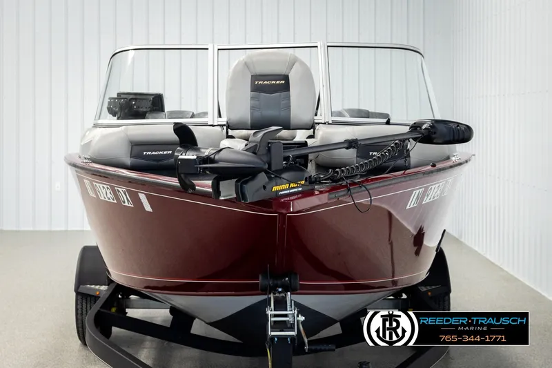 Slide: The Image of 2017 Tracker Pro Guide V-175 Combo boat in showroom, front view, maroon color. - 6