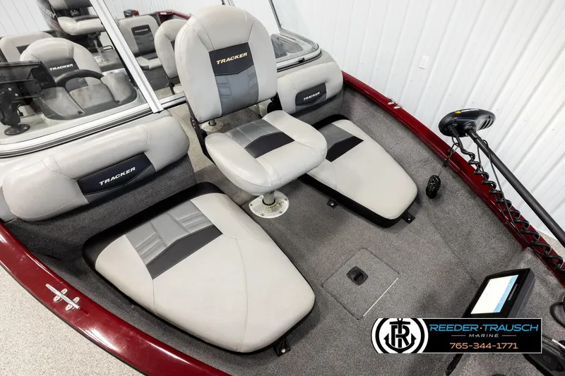 Slide: The Image of 2017 Tracker Pro Guide V-175 Combo boat interior with seating and control panel. - 7