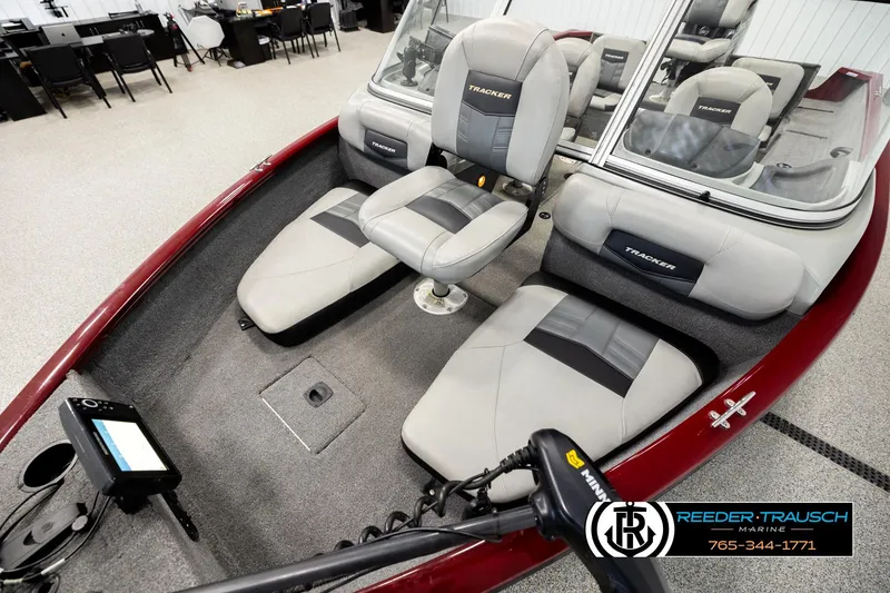 Slide: The Image of 2017 Tracker Pro Guide V-175 Combo boat interior with seating and control panel. - 8