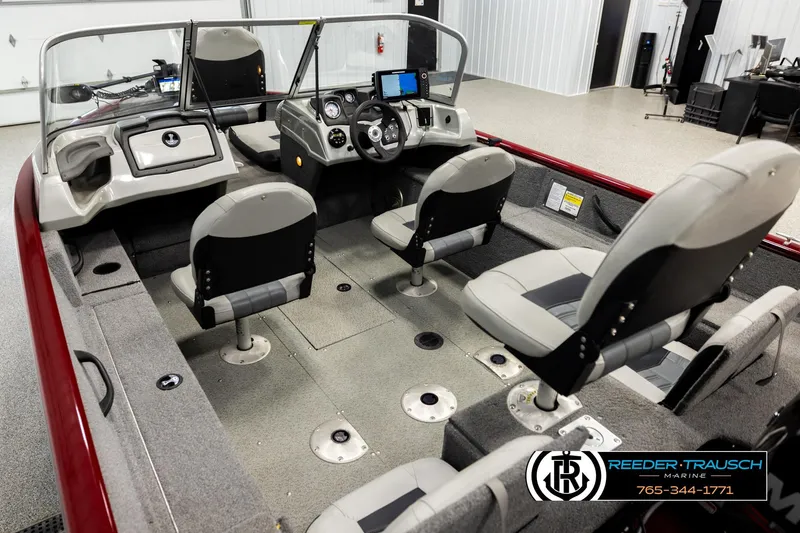 Slide: The Image of 2017 Tracker Pro Guide V-175 Combo boat interior with seating and control panel. - 9