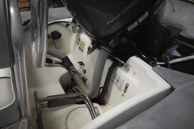 Slide: The Image of 2014 Zodiac Pro 550 boat engine compartment with visible hoses and components. - 10