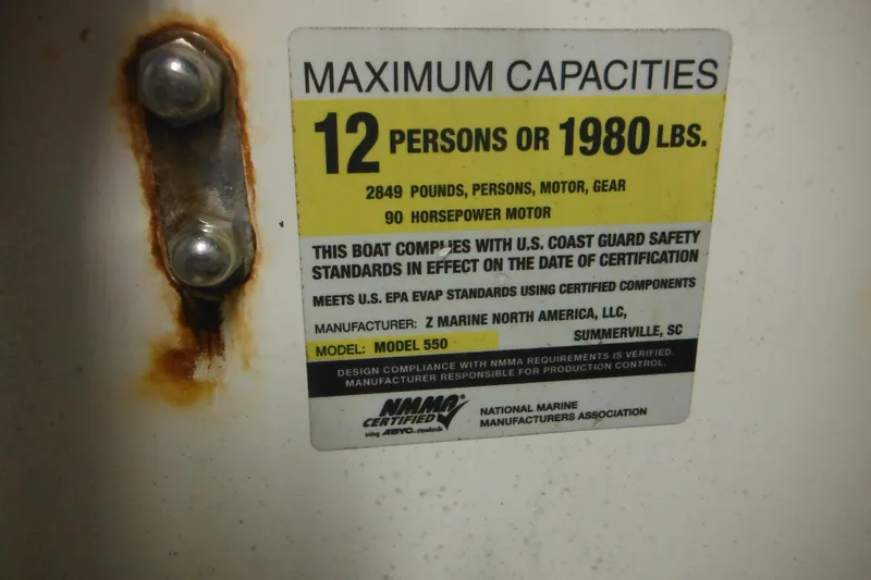 Slide: The Image of Zodiac Pro 550 capacity label, 12 persons or 1980 lbs, 90 horsepower motor, 2014 model. - 17