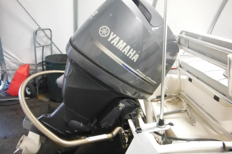 Slide: The Image of 2014 Zodiac Pro 550 with Yamaha four-stroke outboard motor in a garage setting. - 3
