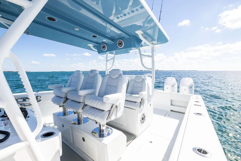 Slide: The Image of 2026 Invincible 38 Catamaran with luxurious seating on open water. - 10