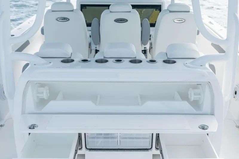 Slide: The Image of 2026 Invincible 40 Catamaran interior with seating and storage compartments. - 13