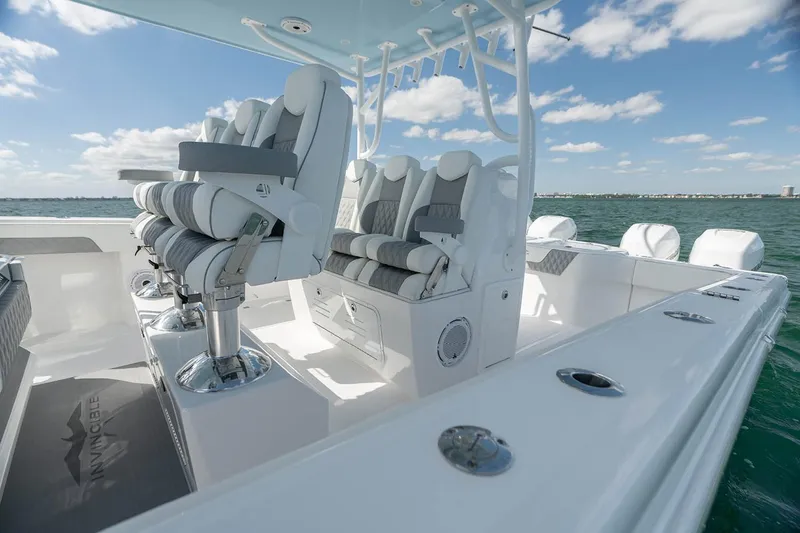 Slide: The Image of Manufacturer Provided Image: 2026 Invincible 40 Catamaran interior with luxurious seating on open water. - 5