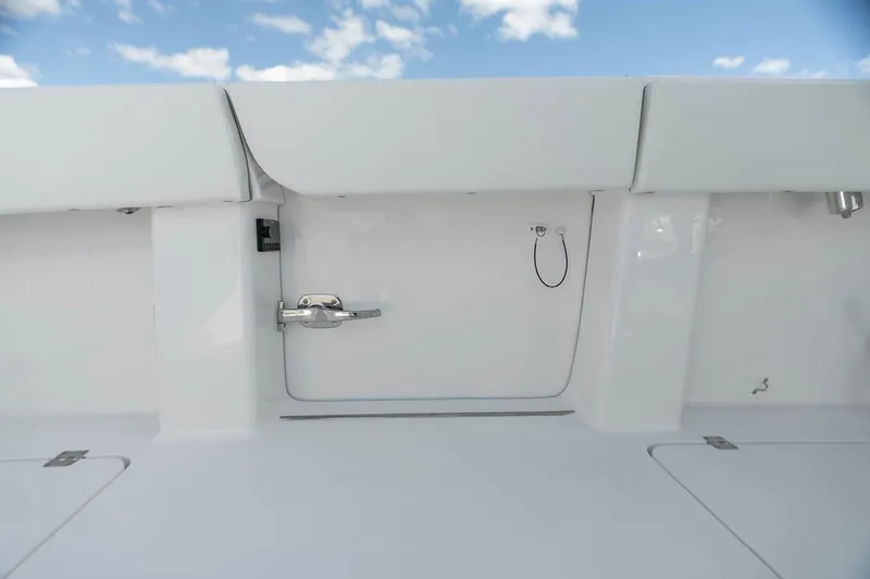 Slide: The Image of Manufacturer Provided Image: 2026 Invincible 40 Catamaran deck with sleek white finish under blue sky. - 8