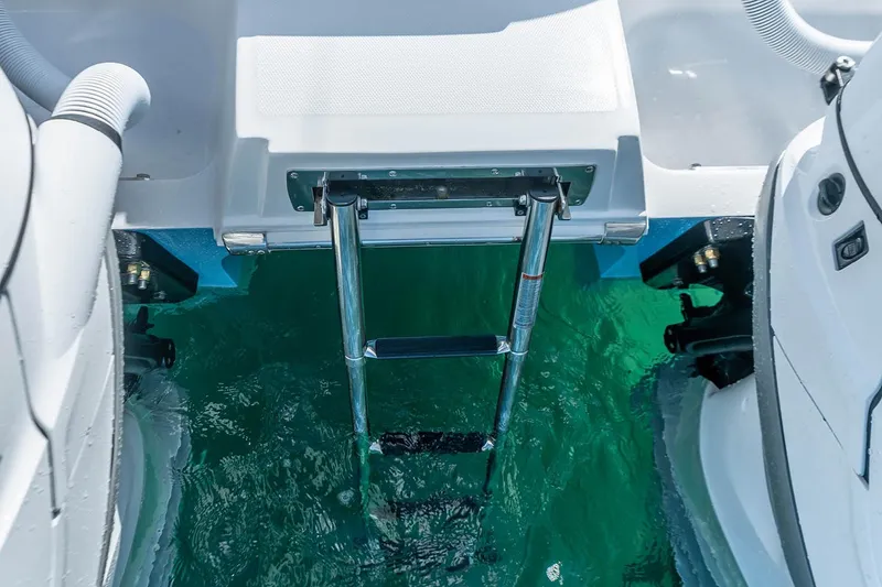 Slide: The Image of Manufacturer Provided Image: Invincible 40 Catamaran 2026 with swim ladder, turquoise water, and dual engines. - 9