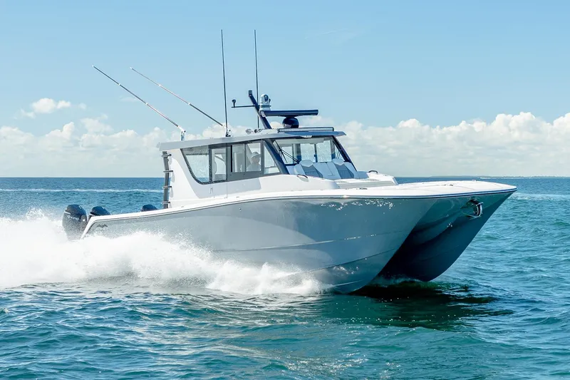 Slide: The Image of Manufacturer Provided Image: 2026 Invincible 46 Pilothouse cruising on open water under clear skies. - 1