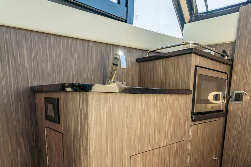 Slide: The Image of Modern kitchenette in 2026 Invincible 46 Pilothouse with sink and microwave. - 11