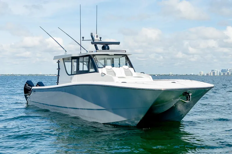 Slide: The Image of Manufacturer Provided Image: 2026 Invincible 46 Pilothouse boat on open water under a cloudy sky. - 2
