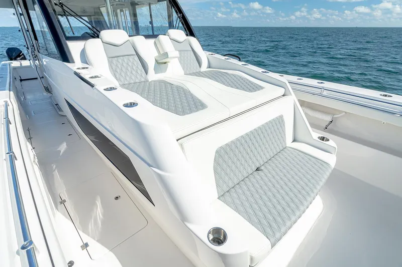 Slide: The Image of Manufacturer Provided Image: 2026 Invincible 46 Pilothouse boat with luxurious seating on open water. - 6