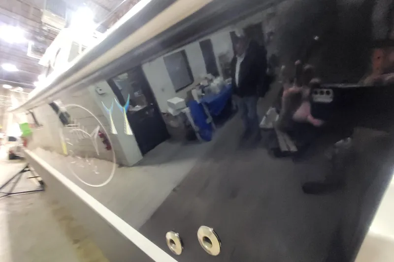 Slide: The Image of 2020 Steiger Craft 31 Miami boat in a workshop, reflecting surroundings. - 10