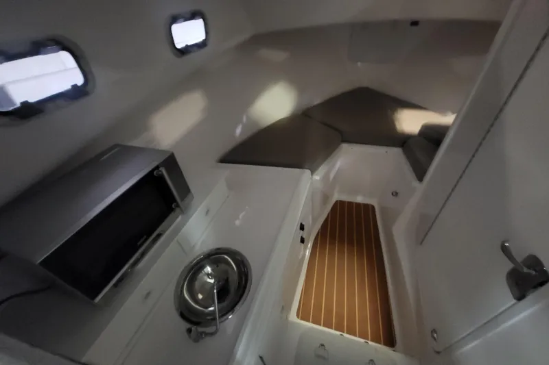 Slide: The Image of Interior of 2020 Steiger Craft 31 Miami boat with kitchenette and seating area. - 24