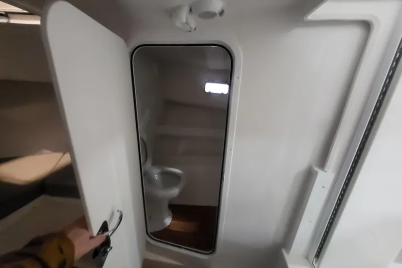 Slide: The Image of 2020 Steiger Craft 31 Miami boat interior with compact bathroom and toilet. - 26