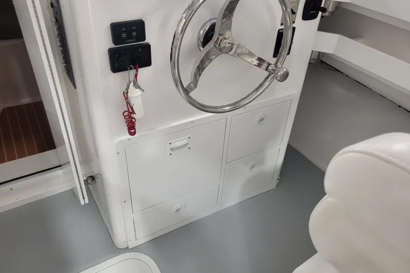 Slide: The Image of 2020 Steiger Craft 31 Miami boat helm with steering wheel and control panel. - 30