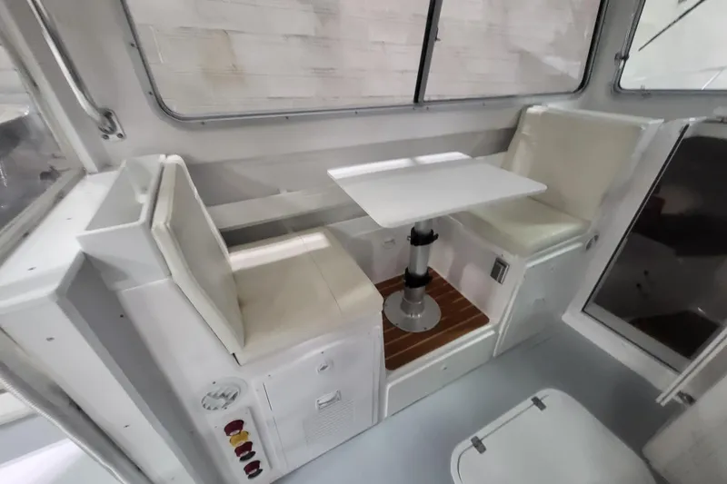 Slide: The Image of Interior of 2020 Steiger Craft 31 Miami boat with seating and table. - 35