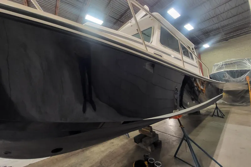 Slide: The Image of 2020 Steiger Craft 31 Miami boat in indoor storage, side view. - 5