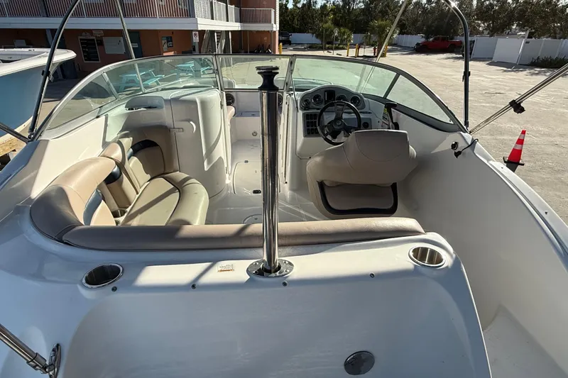 Slide: The Image of 2015 Hurricane SunDeck 2000 OB boat interior with seating and steering console. - 18