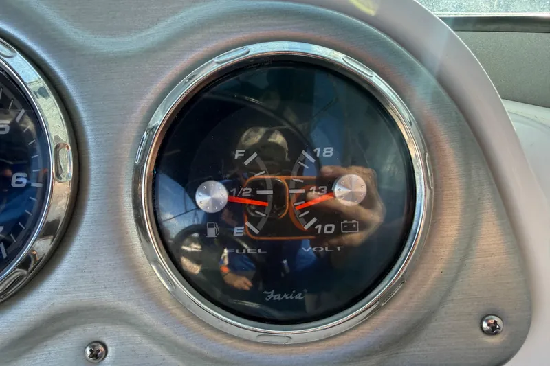 Slide: The Image of Close-up of 2015 Hurricane SunDeck 2000 OB fuel and volt gauge. - 30