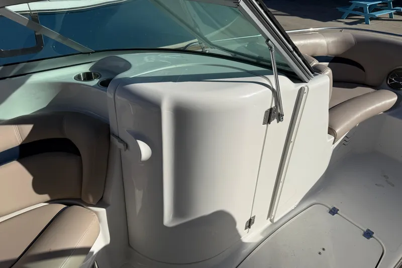 Slide: The Image of 2015 Hurricane SunDeck 2000 OB interior with beige seating and windshield. - 35