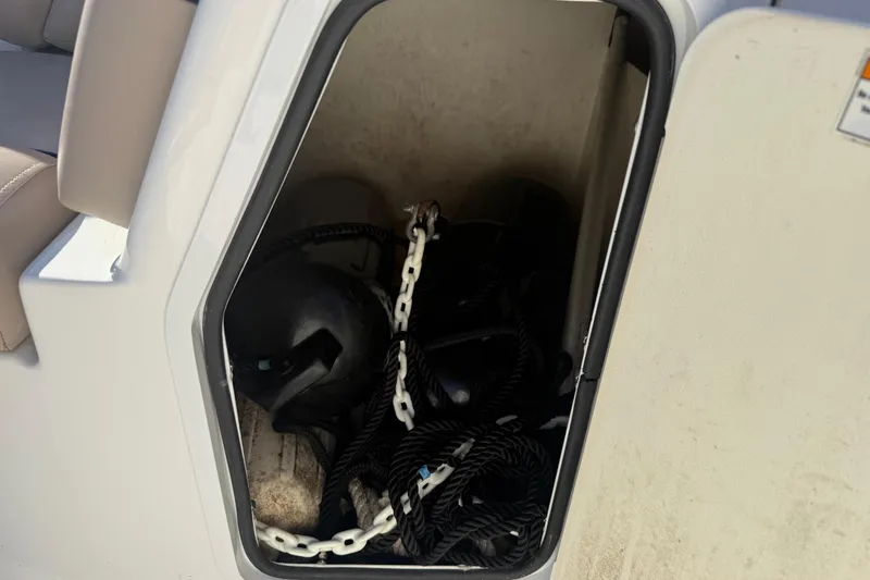 Slide: The Image of Storage compartment on 2015 Hurricane SunDeck 2000 OB with ropes and fenders. - 40