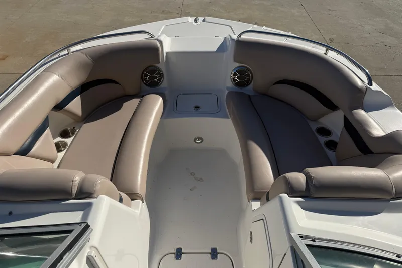 Slide: The Image of 2015 Hurricane SunDeck 2000 OB boat interior with beige seating and cup holders. - 41