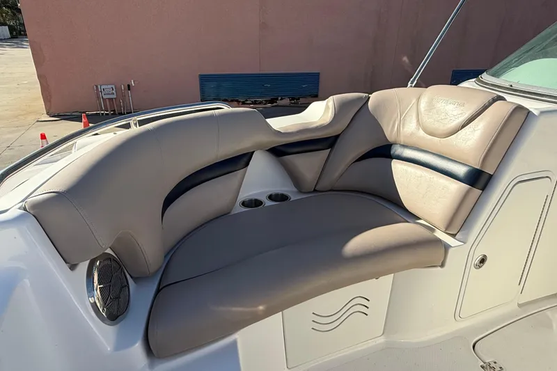 Slide: The Image of 2015 Hurricane SunDeck 2000 OB boat interior with cushioned seating and cup holders. - 42