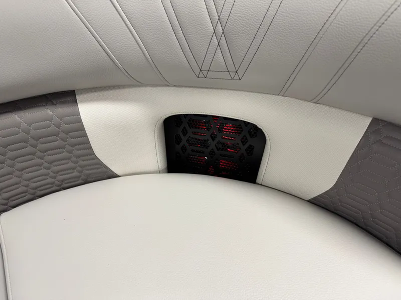 Slide: The Image of Close-up of a luxurious boat seat with elegant stitching and a stylish speaker grille. - 25