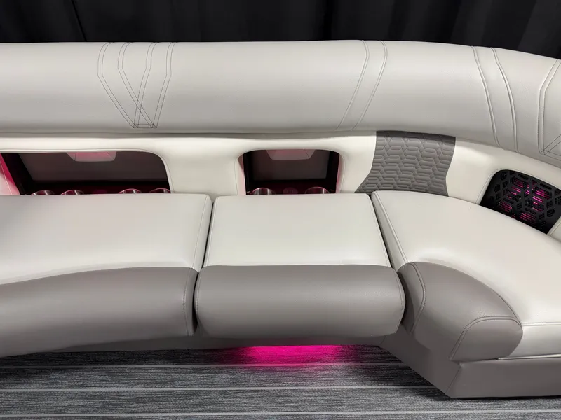 Slide: The Image of Luxurious seating area with gray and white upholstery, surrounded by ambient lighting. - 27
