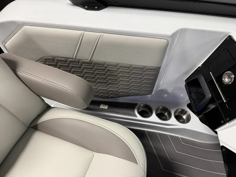 Slide: The Image of Interior of a 2027 Premier 250INTRIGUE with gray upholstery and cup holders. - 48